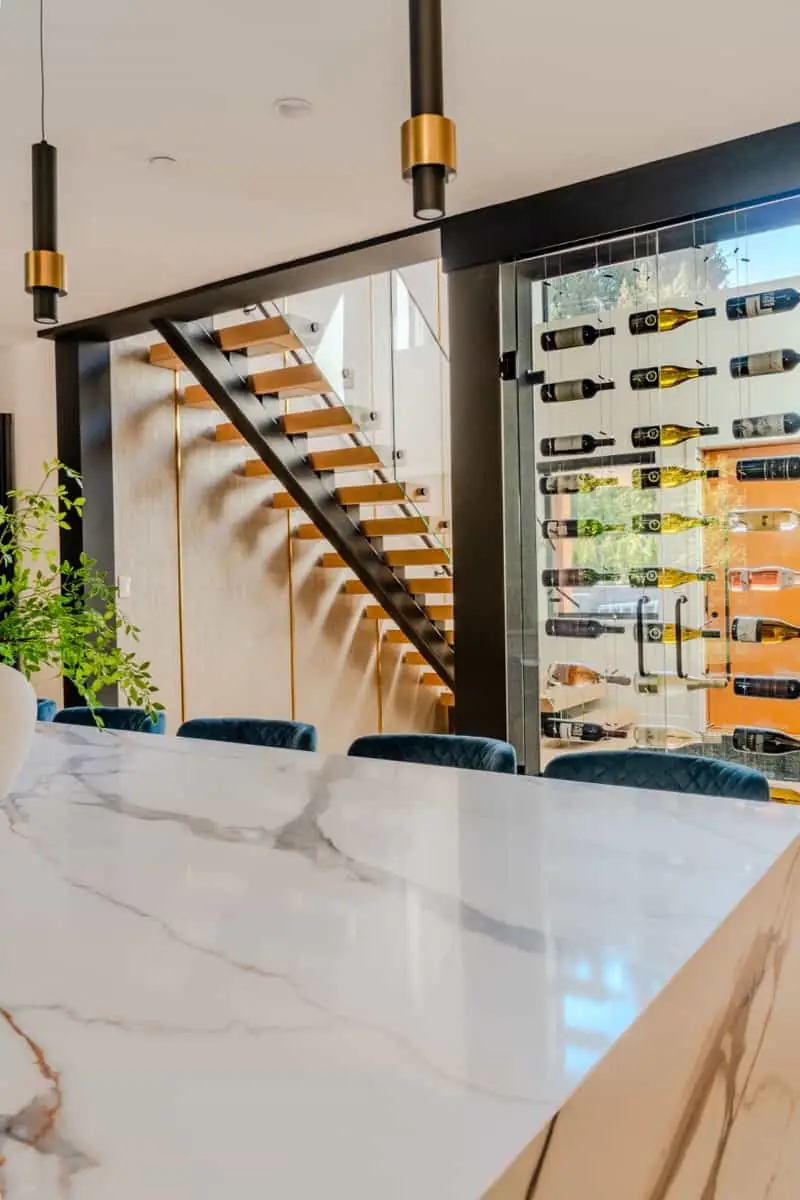 Dining area with glass wine wall and marble island, Vancouver luxury real estate photography