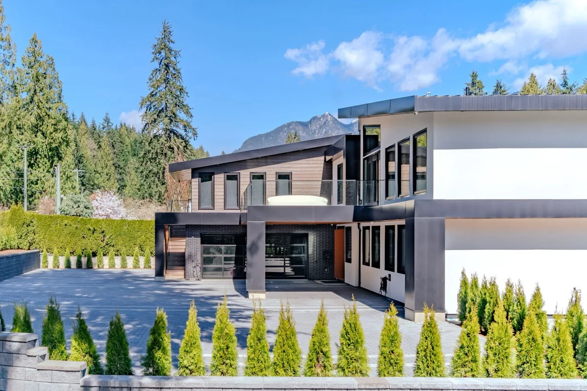 Luxury home exterior, drone context shot